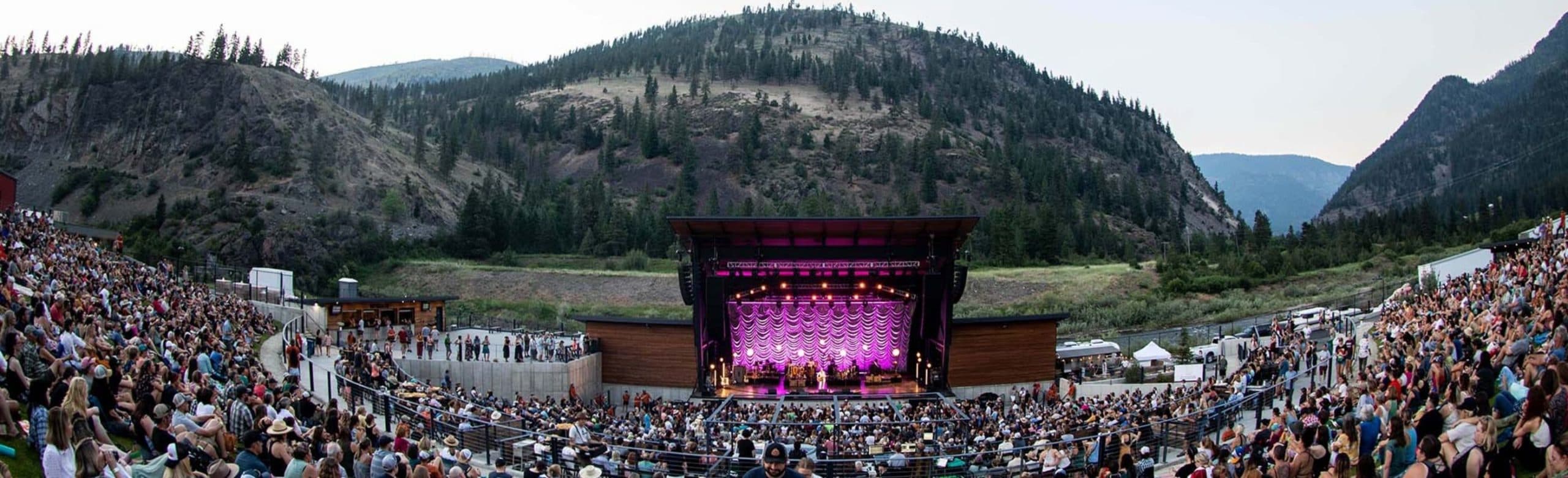 Kettlehouse Amphitheater stage and crowd at dusk, produced by Shaped Music